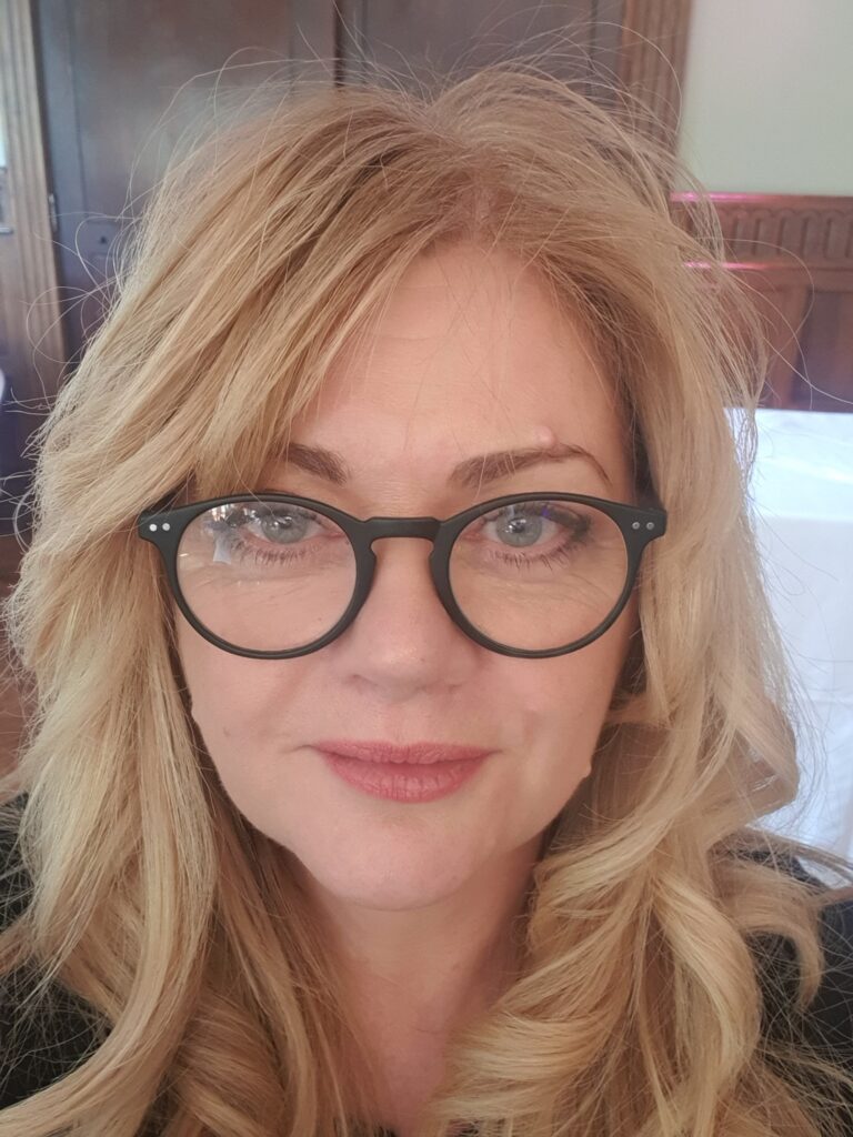 About - Close up of Sian Llewellyn a blonde lady with glasses, the founder of Foundation 14a