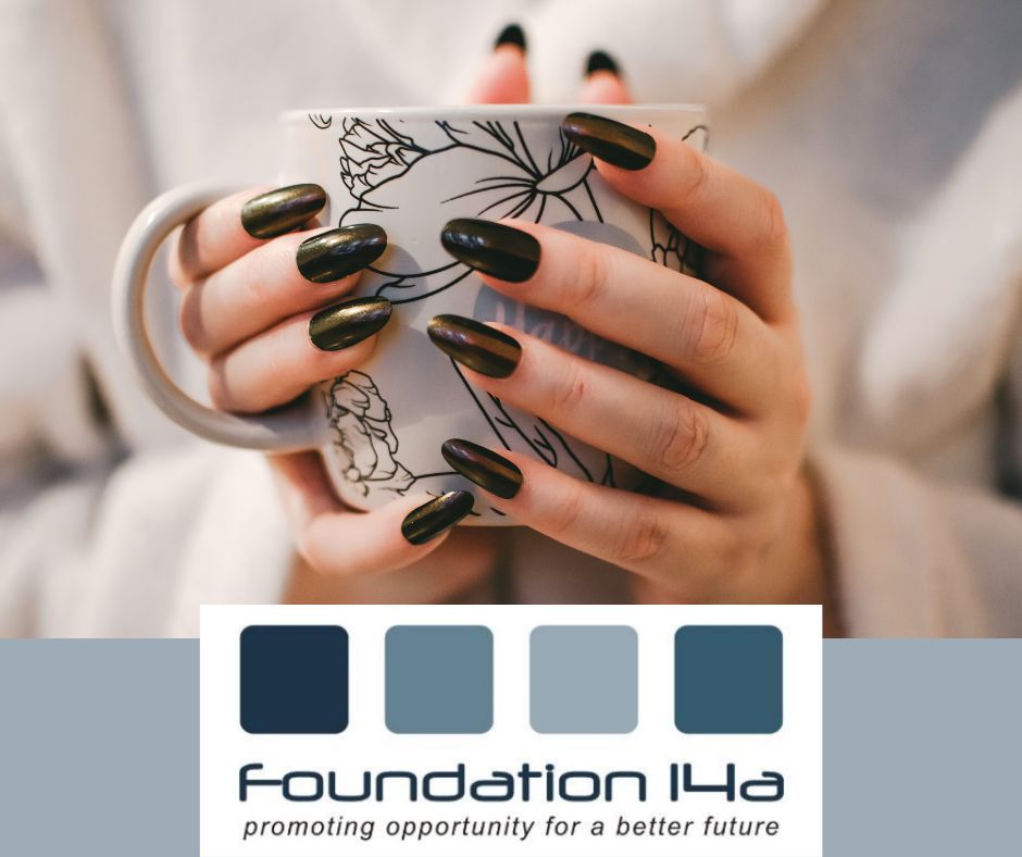 Foundation 14a - close up of a lady with dark painted nails, clasping a grey floral mug