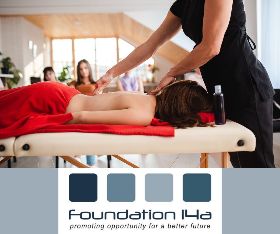 Intensive Beauty Therapy courses - a tutor is demonstrating to the class how to massage, using a live model