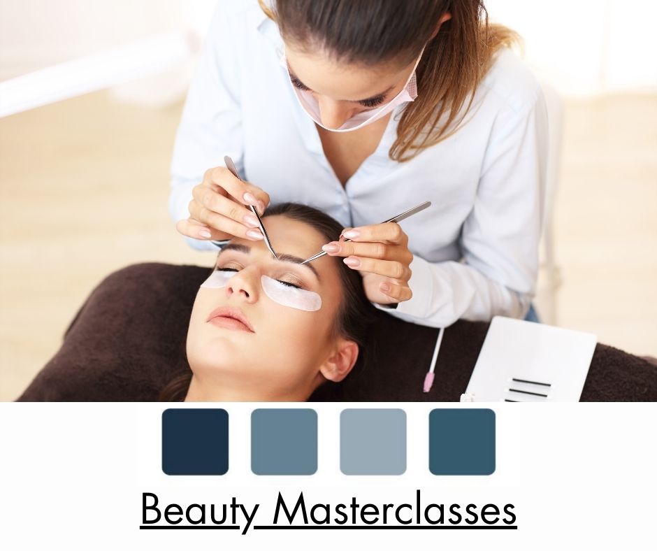 Beauty Training - A beautician in a white uniform, wearing a mask, sits behind a treatment couch working on a female client's eyebrows