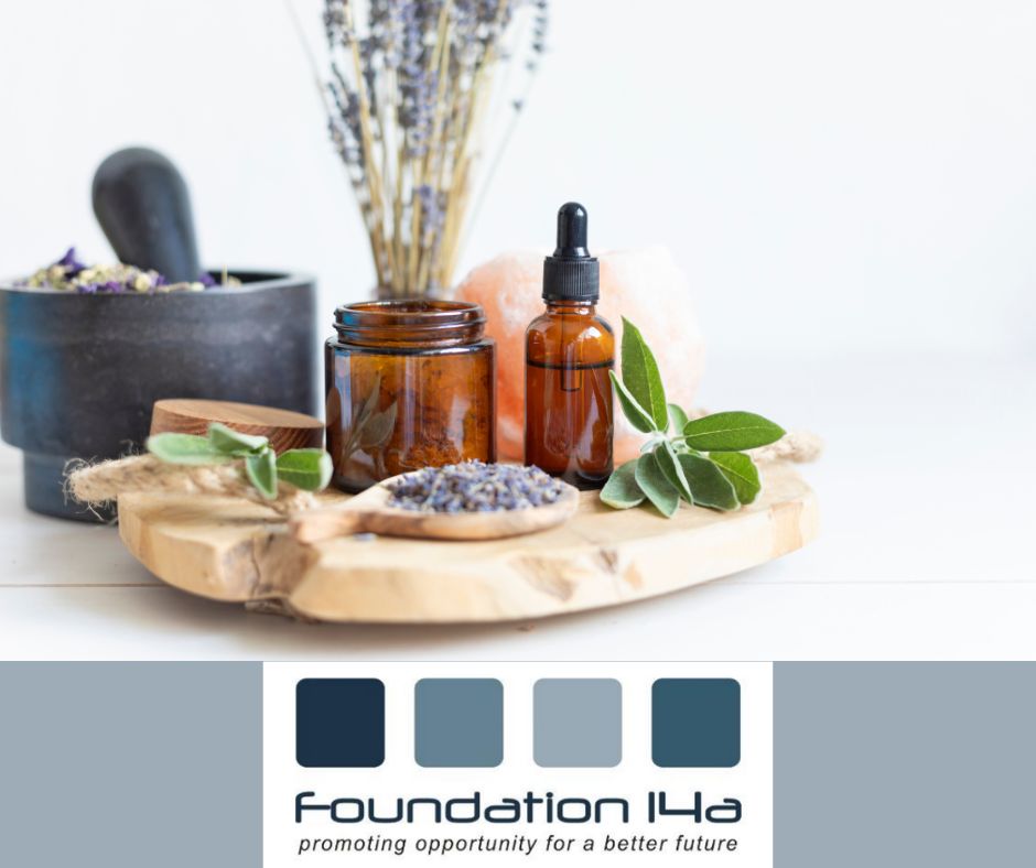 Beauty Courses - A wooden board with a pestle and mortar, lavender, brown jars and herbs