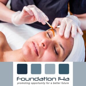 Eyebrow waxing beauty course- a student applying wax to a model's brows ready to wax