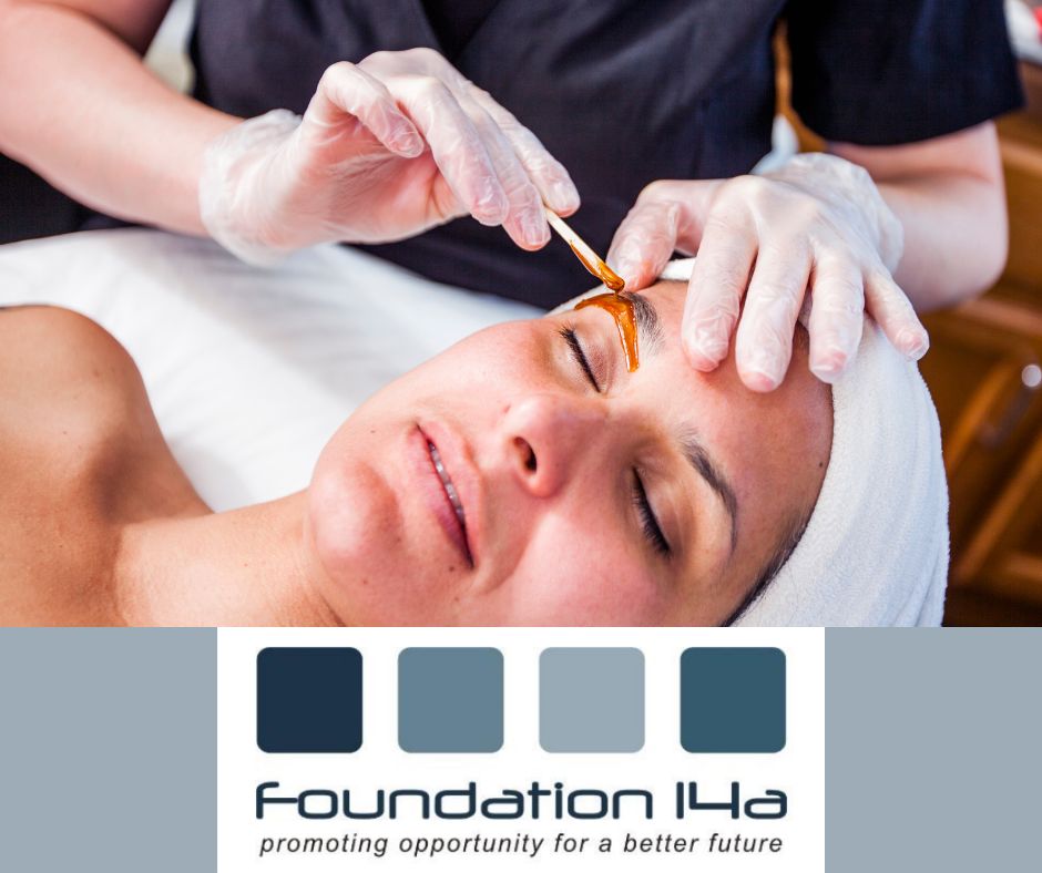 Eyebrow waxing beauty course- a student applying wax to a model's brows ready to wax