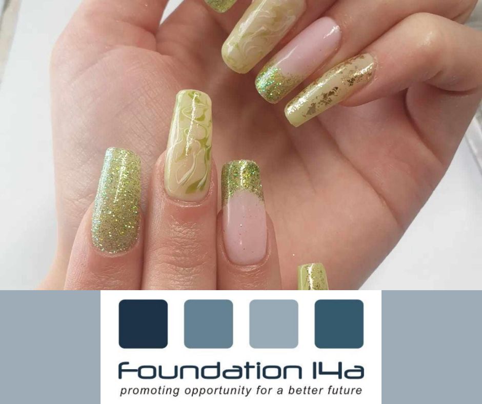 Close up nails with artistic gold and green patterns on them created during the nait art training course