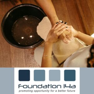 Close up of a lady's foot next to a bowl of water receiving a treatment during the pedicure training course