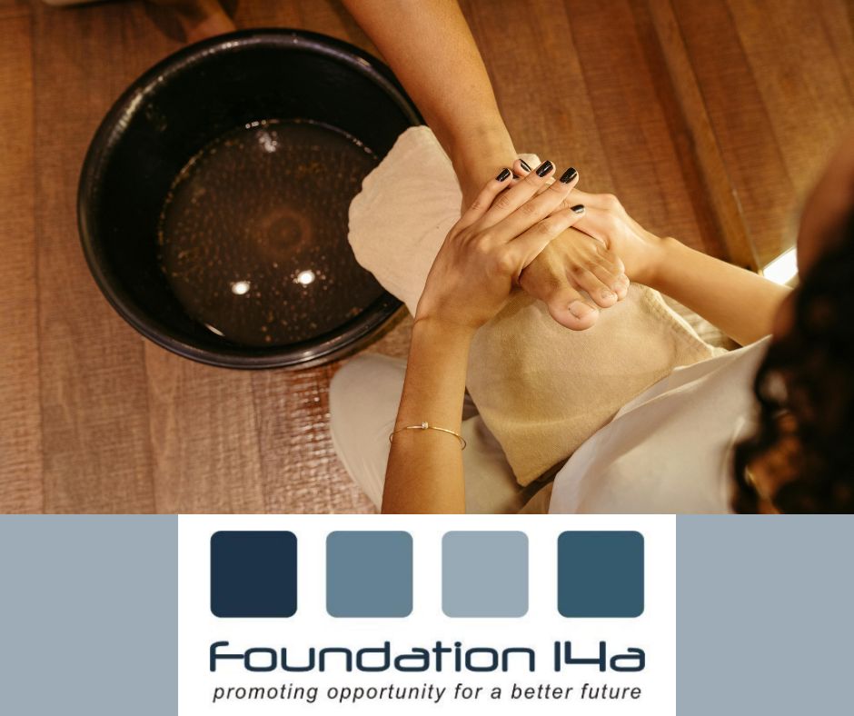 Close up of a lady's foot next to a bowl of water receiving a treatment during the pedicure training course