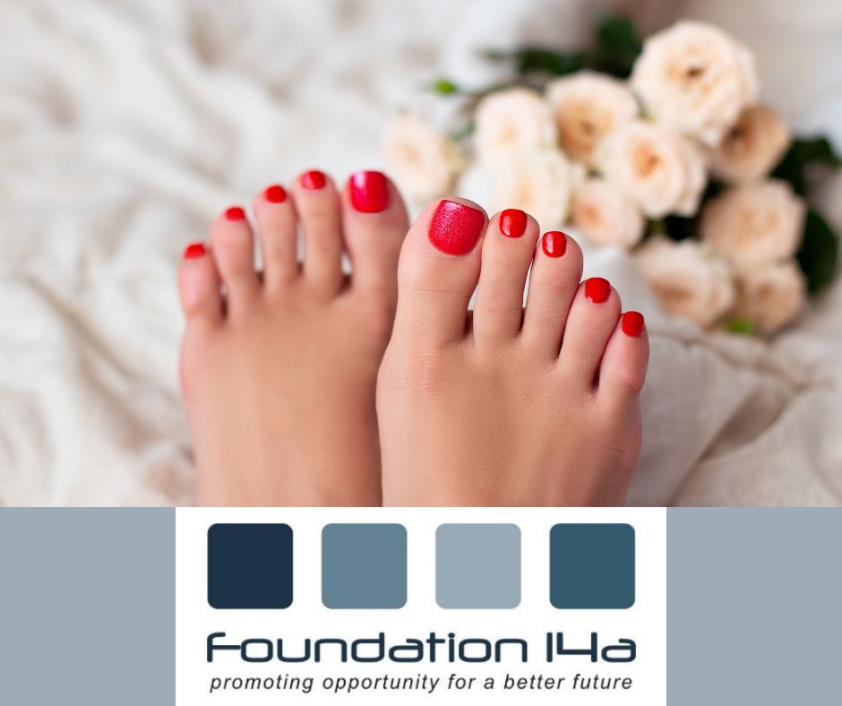 Close up of a lady's toe nails after a pedicure training course - painted in red gel varnish