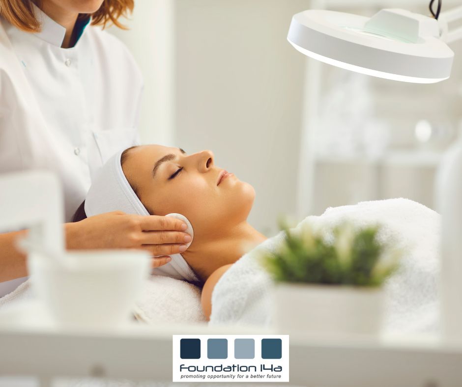 A student on one of our beauty courses is doing a facial on a lady lying on a treatment couch