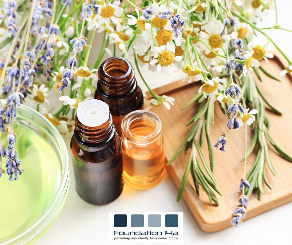 Holistic Beauty Therapy Courses represented by lavender, camomile and rosemary with some brown pots of essential oils
